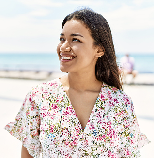 Woman smiling at the beach
